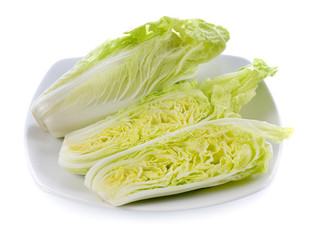 fresh chinese cabbage in white plate isolated on white background