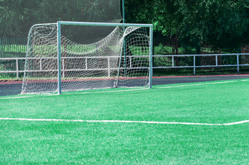 Fototapeta premium Gate on a football field with a green lawn.