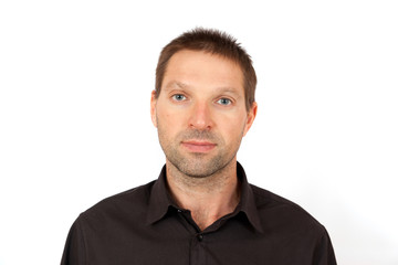 Fototapeta premium Portrait of a young man in a brown jacket