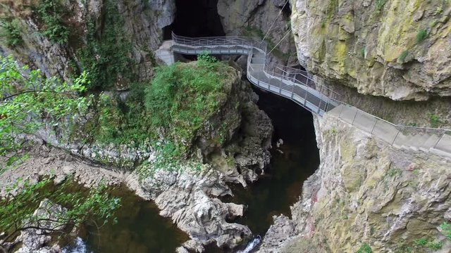 4K. Beautiful Skocjan Caves and bridge over the karstic river, Natural Heritage Site in Slovenia. Panoramic view.