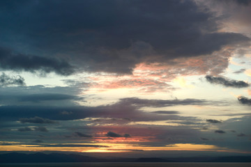 Fototapeta na wymiar Beautiful sunrise in the sea with clouds