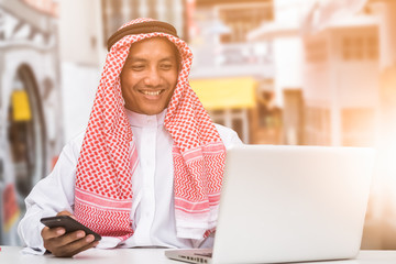 Arab business man sitting at a desk in the office