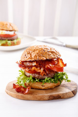 Close-up of beef burger on white background.