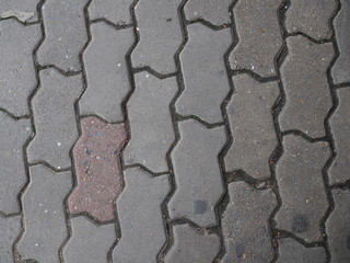 Grey vertical jigsaw, zigzag worm cement pattern floor background