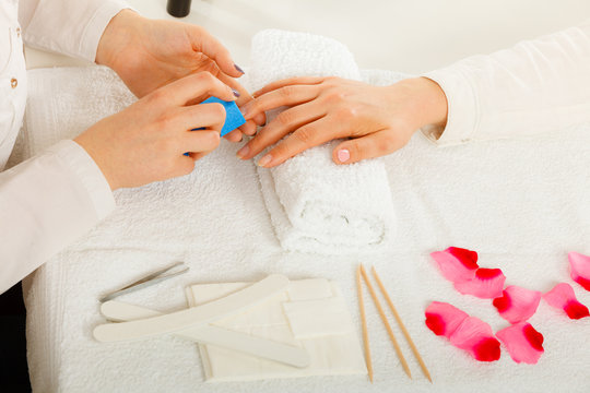 Woman Getting Manicure Done File Nails