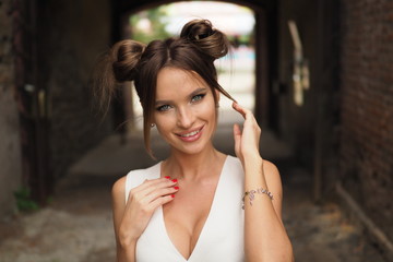 Woman smiling with perfect smile and white teeth in a tunnel and looking at camera