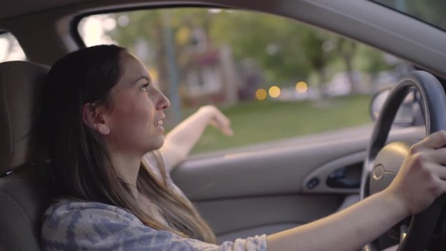 Carefree Driver Puts Her Hand Out The Window, Feels The Breeze (Slow Motion)