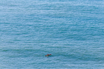 Fototapeta premium Tourist kayaking on the sea
