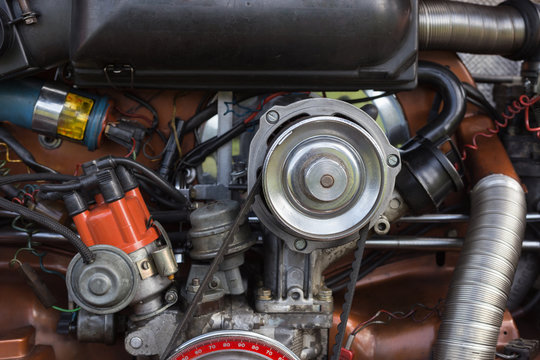 engine and parts of old orange color beetle in south germany on a sunny august morning