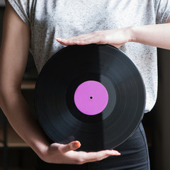 Dj style. Vinyl records background. Modern youth lifestyle, unrecognizable female, music concept