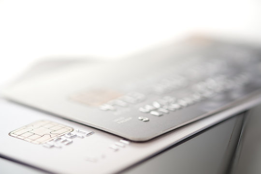 Credit cards on smartphone with shallow focus white background, toned picture