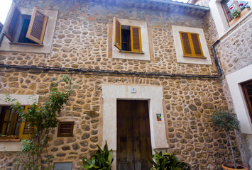 Fototapeta na wymiar Beautiful building in Valldemossa, famous old mediterranean village of Majorca Spain.