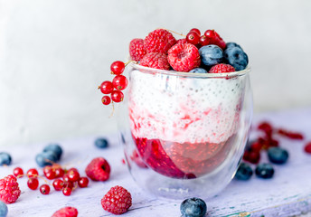 Dessert from yogurt with chia seeds, raspberries and blueberries