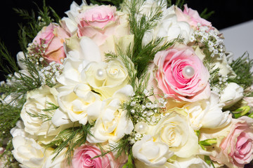 Wedding rings and roses bouquet
