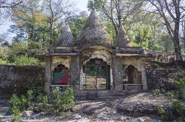 The entrance to now abandoned Maharishi Mahesh Yogi Ashram - Beatles Ashram in Rishikesh. - obrazy, fototapety, plakaty
