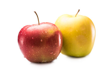 close up view of fresh and ripe apples with water drops isolated on white