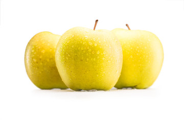 close up view of fresh and ripe apples with water drops isolated on white