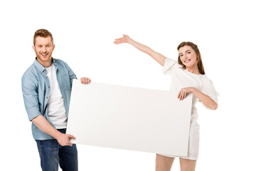 couple holding blank banner