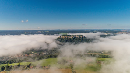 Aerial view on Koenigstein fortress in the morning with a mist in the valley of the River Elbe