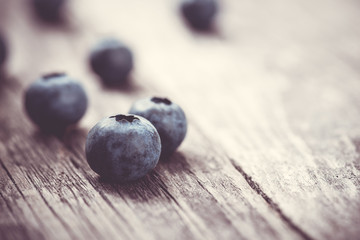 Berries. Blueberries on the rustic wooden board