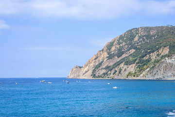 Fototapeta premium Beautiful daylight view to blue sea and green mountains. Monterosso al Mare, Italy. Cinque Terre