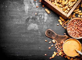 Peanut butter with nuts in a bowl.