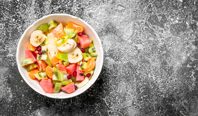 Tropical food . Fruit salad in a bowl.