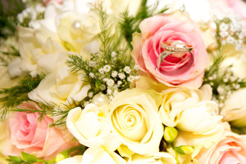 Delicate Wedding background with Rings and Buttercup Flower