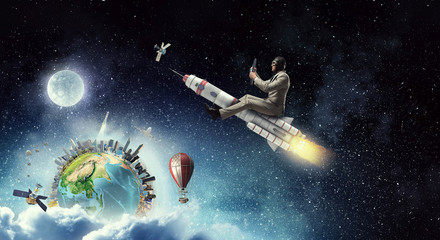 Obraz na płótnie Canvas Aviator riding rocket. Mixed media . Mixed media