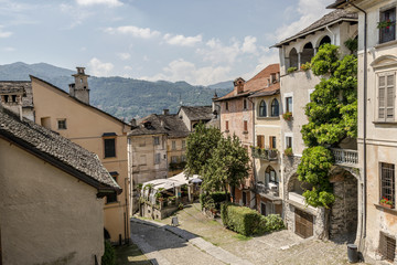 old houses on steep street at Orta san Giulio, Italy