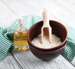 Sesame seeds and bottle with oil