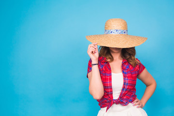 Beautiful graceful woman in elegant hat with a wide brim. Beauty, fashion concept.