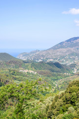 Beautiful landscape daylight view to green mountains and blue sea of Monterosso al Mare in Italy. Cinque Terre beauties
