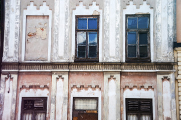 an old facade with many windows in vivid colors