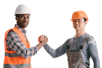 team of african-american and asian construction workers