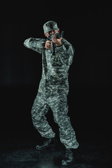 Fototapeta na wymiar soldier in military uniform with rifle