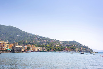 Fototapeta premium Daylight view to mountains, blue sea and city of Rapallo, Italy.