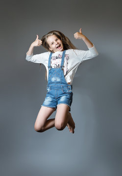 Lovely girl joyfully jumping