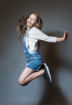 Lovely girl joyfully jumping