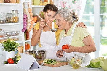 Mother and daughter cooking together 