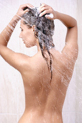 Naklejka premium happy young woman in shower