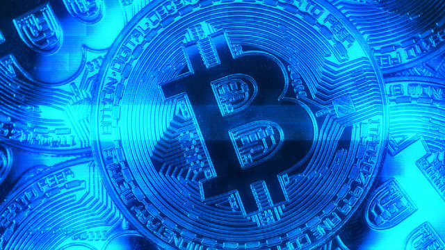 Crypto currency Gold Bitcoin - BTC - Bit Coin. Macro shots crypto currency Bitcoin coins. Holomatrix style blue.