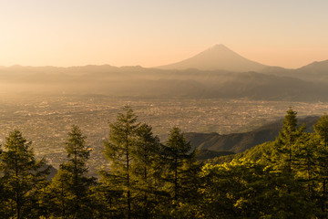 Mt.Fuji and Kofu city with sunrise sky seen from Mt. Amariyama view point.