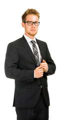 Young, handsome business man wearing black suit.