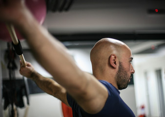 Fototapeta premium Man and young woman preparing for workout in the gym.