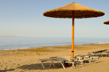 Sun loungers and umbrella