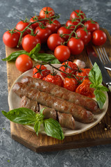 Fried sausages with tomatoes