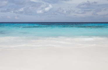 Fototapeta na wymiar White beach sand and beautiful blue sea and sky