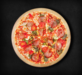 Pizza salami on a black background. Visit my page. You will be able to find an image for every pizza sold in your cafe or restaurant.
  