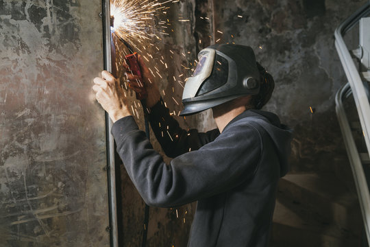 Blacksmith welding indoors